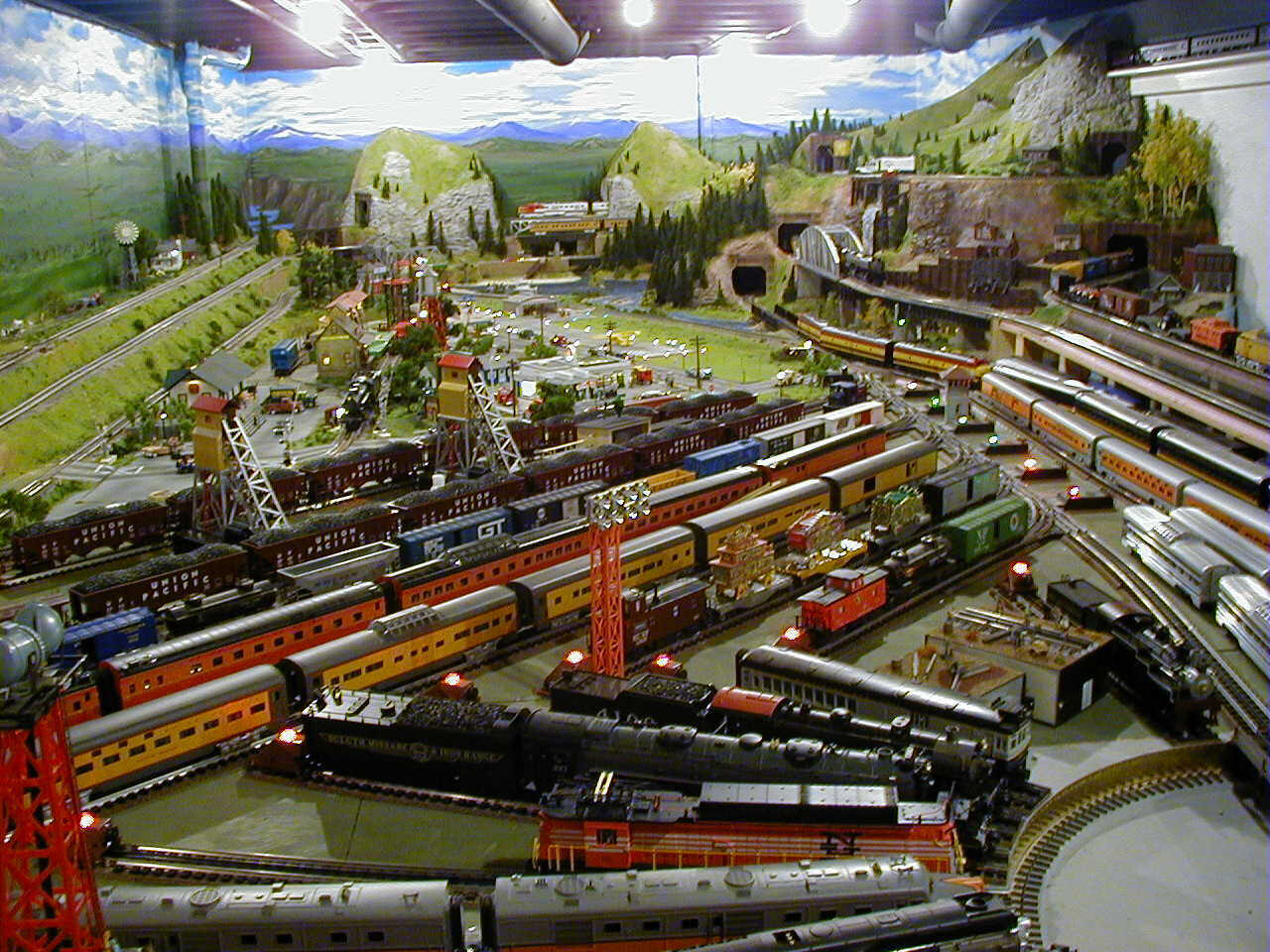 Look at all of the various trains on this awesome HO train layout. The 