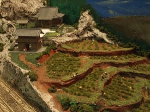 farmers and houses in japan-themed model railroad