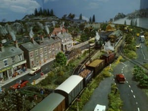 Model railroad with houses, streets, and people set in Japan