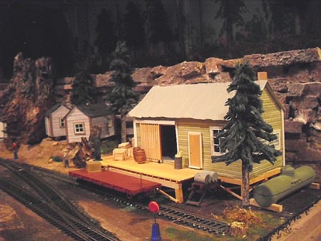 cabin with wooden platform of the model railroad
