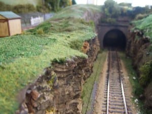 The entrance of a tunnel on the model railroad layout.