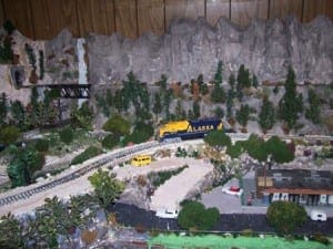 Waterfall beside a bridge on the model train layout.