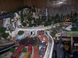 Overview of the model train layout with bridge, waterfalls, and railway turntable. 