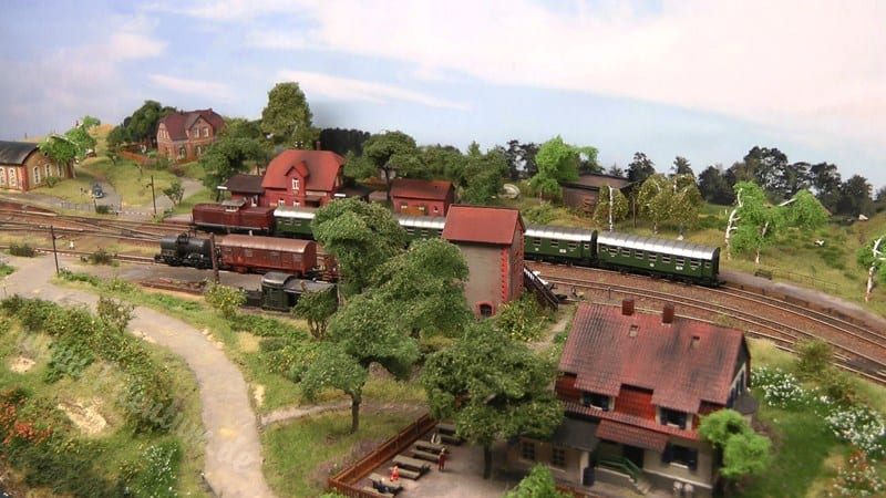 Backdrop of blue sky with clouds on the z scale train layout.