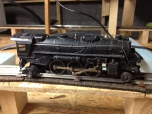 black model train sitting on the track