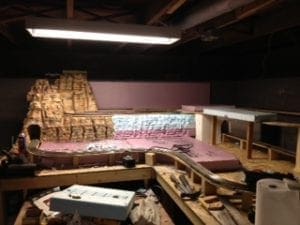 Model railroad tunnel with newly constructed wall 
