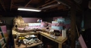 blue and pink slabs stacked on top of each other to form the railroad model's tunnel