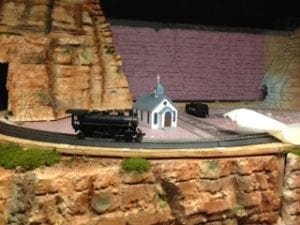 Church in the valley beside the tracks