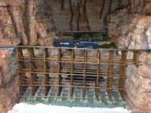Model train in the middle of the bridge