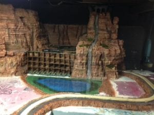 body of water under the waterfalls on the model railroad