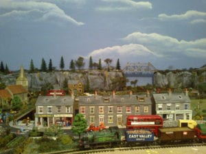 buildings and model train on the muddleton village model railroad