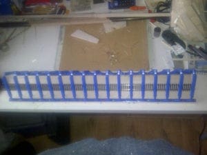 blue plastic girders over the train tracks