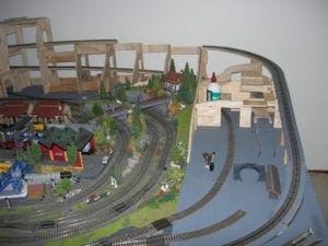 Wooden skeleton of the model railroad's tunnel with some materials. 