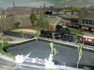 close up image of the train station with the backdrop of the town