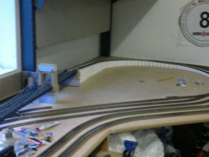bridge of unfinished railroad model layout