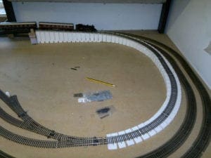 Train on unfinished railroad model