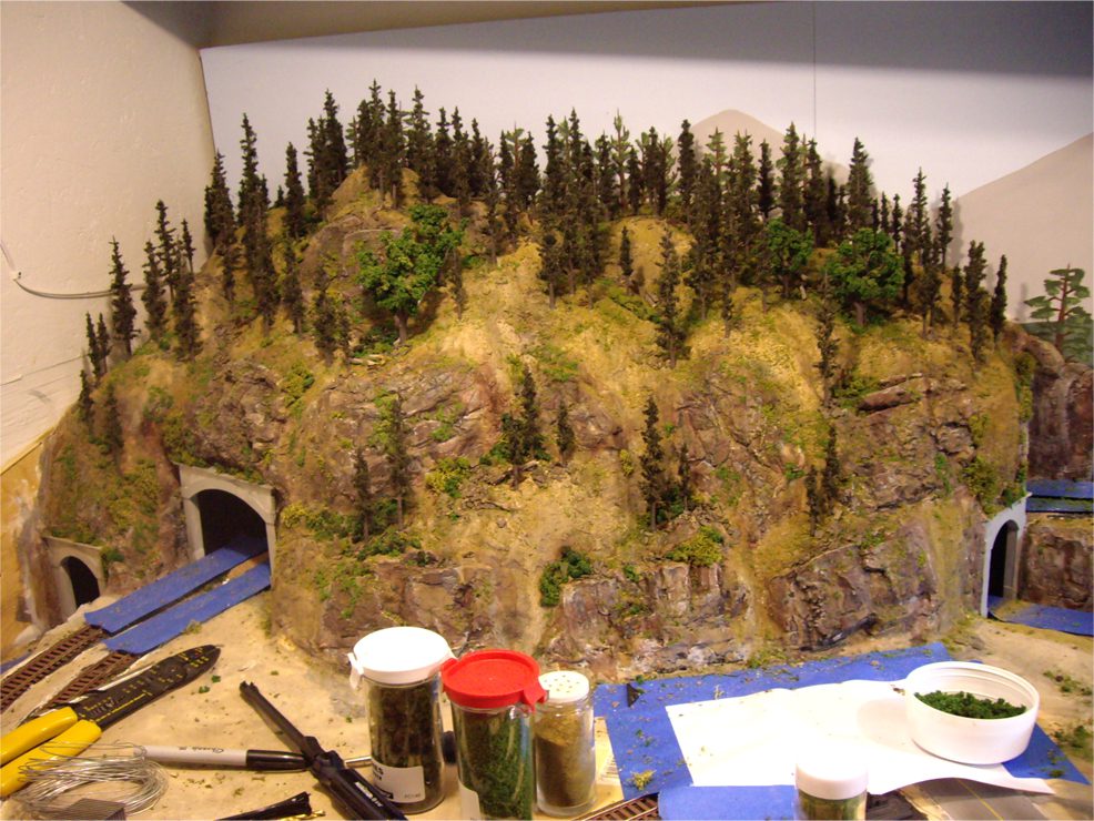 model train mountain scenery with supplies 