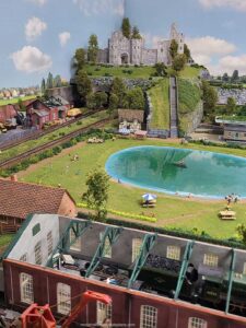 HO scale western steam railroad layout with roundhouse and turntable circa 1890s